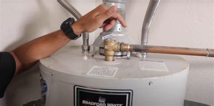 hot water heater leaking from top